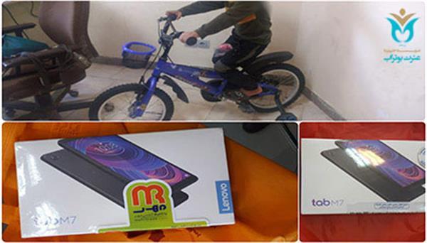 Donation a bike and two tablets to the children of Bootorab